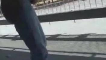Adolescent female defecating beneath the overpass